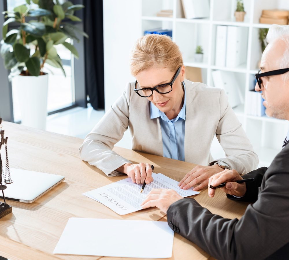 mature-lawyers-looking-at-contract-in-modern-workplace-1.jpg